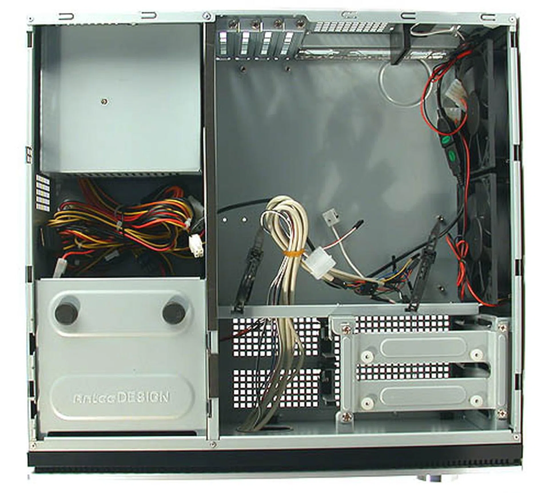 A view of the interior out of the box. You can see the distinct segregation of the various compartments. The motherboard, hard drives are given their own space, while the optical drive shares the same compartment as the PSU.