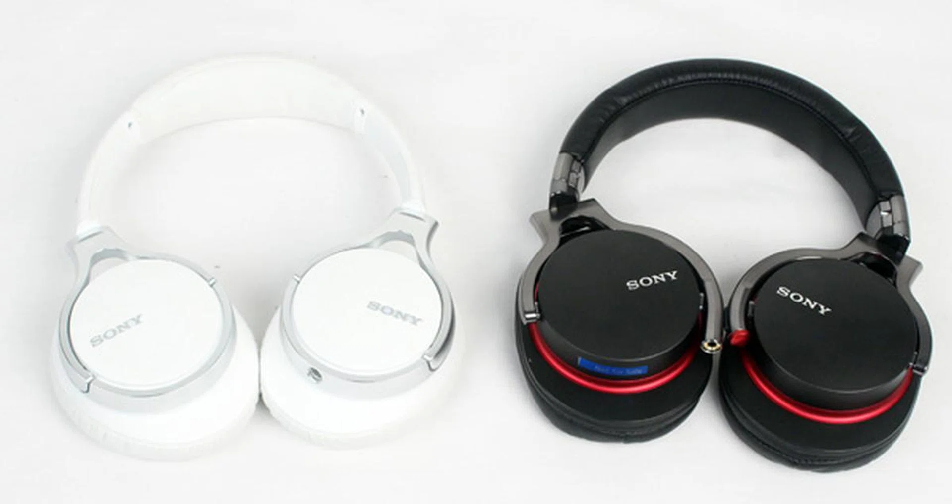 A side by side comparison of the new Sony MDR-10R (left) and the older Sony MDR-1R (right).