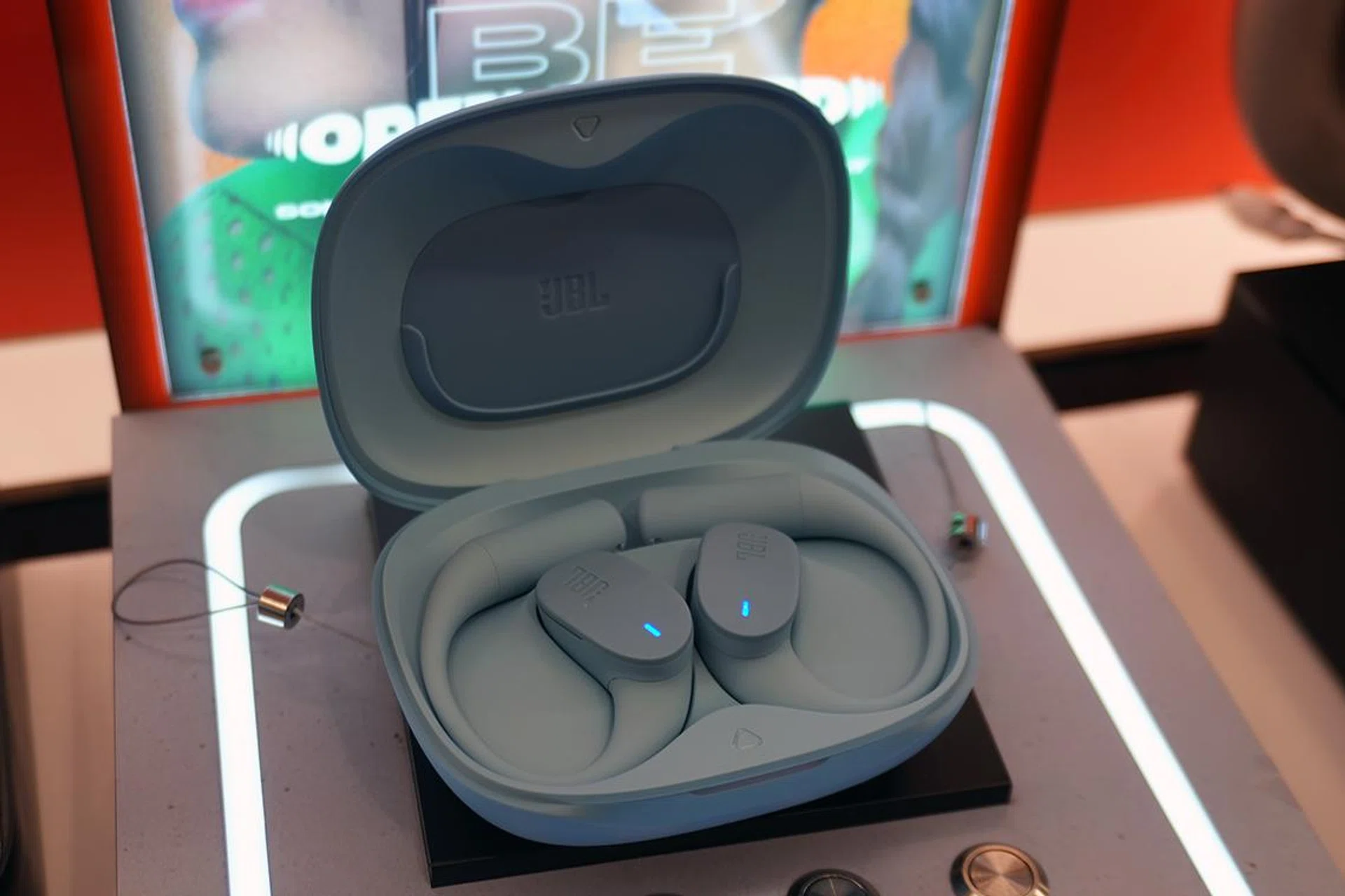 Blue JBL Sense lite in charging case 