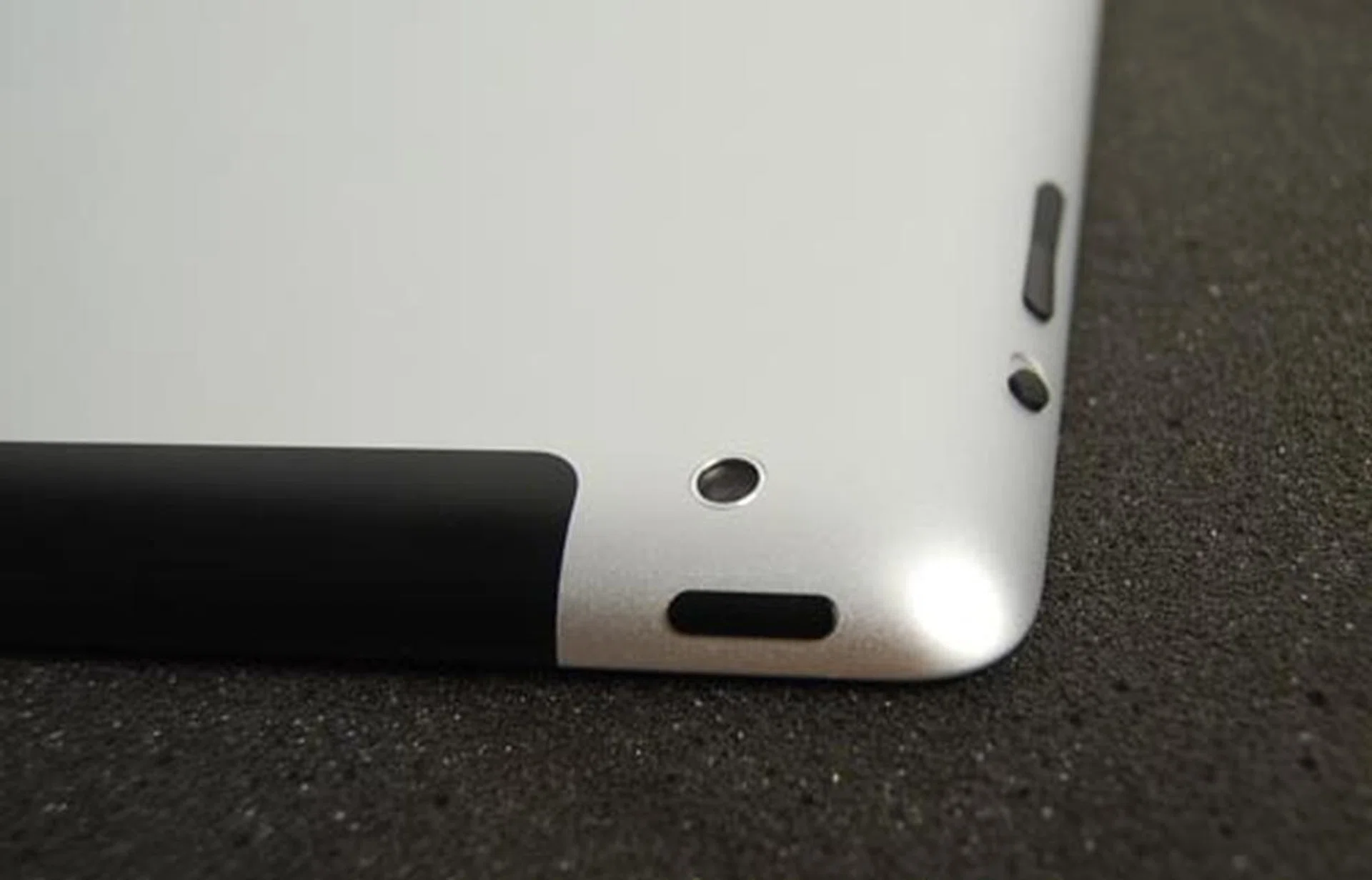 The back camera, power button, lock/mute switch and volume controls of the iPad 2.