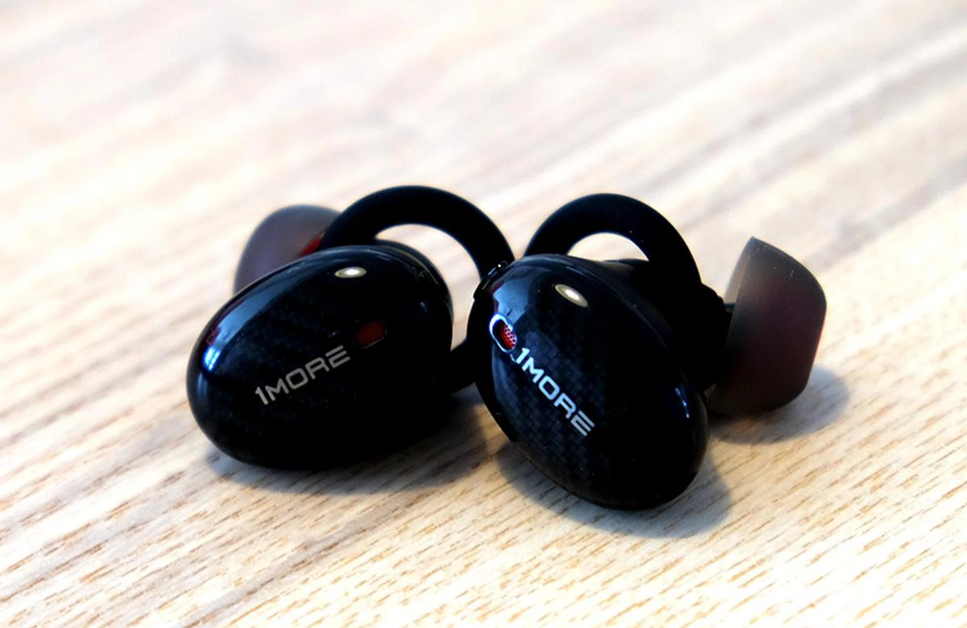 The earbuds have carbon fiber prints.