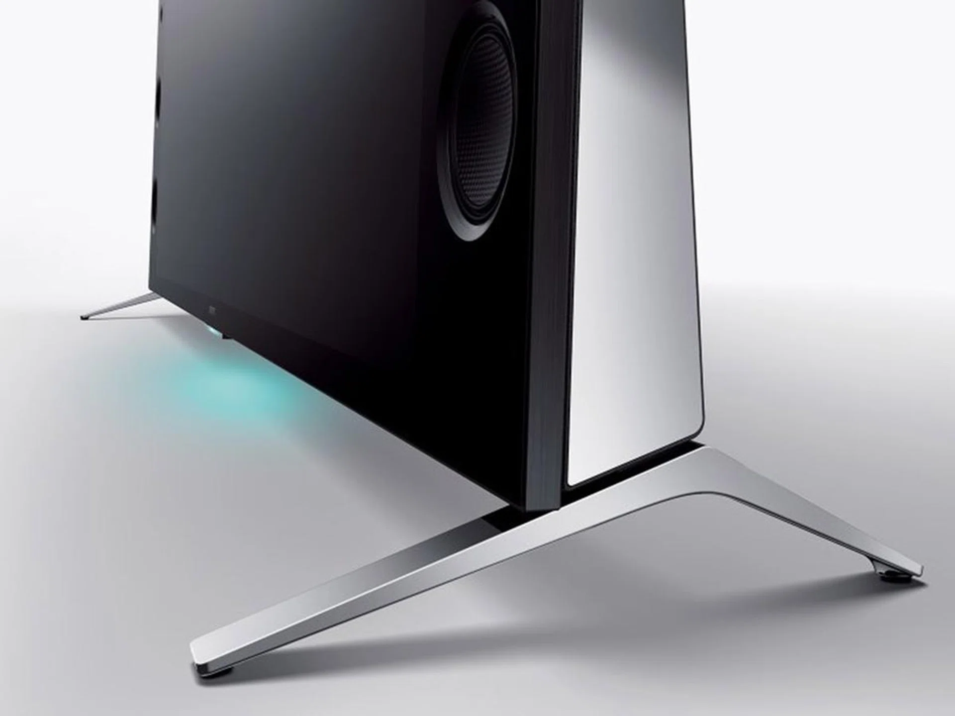 The wedge design enables a larger speaker capacity. The feet below the TV can also be moved to accommodate smaller TV consoles.