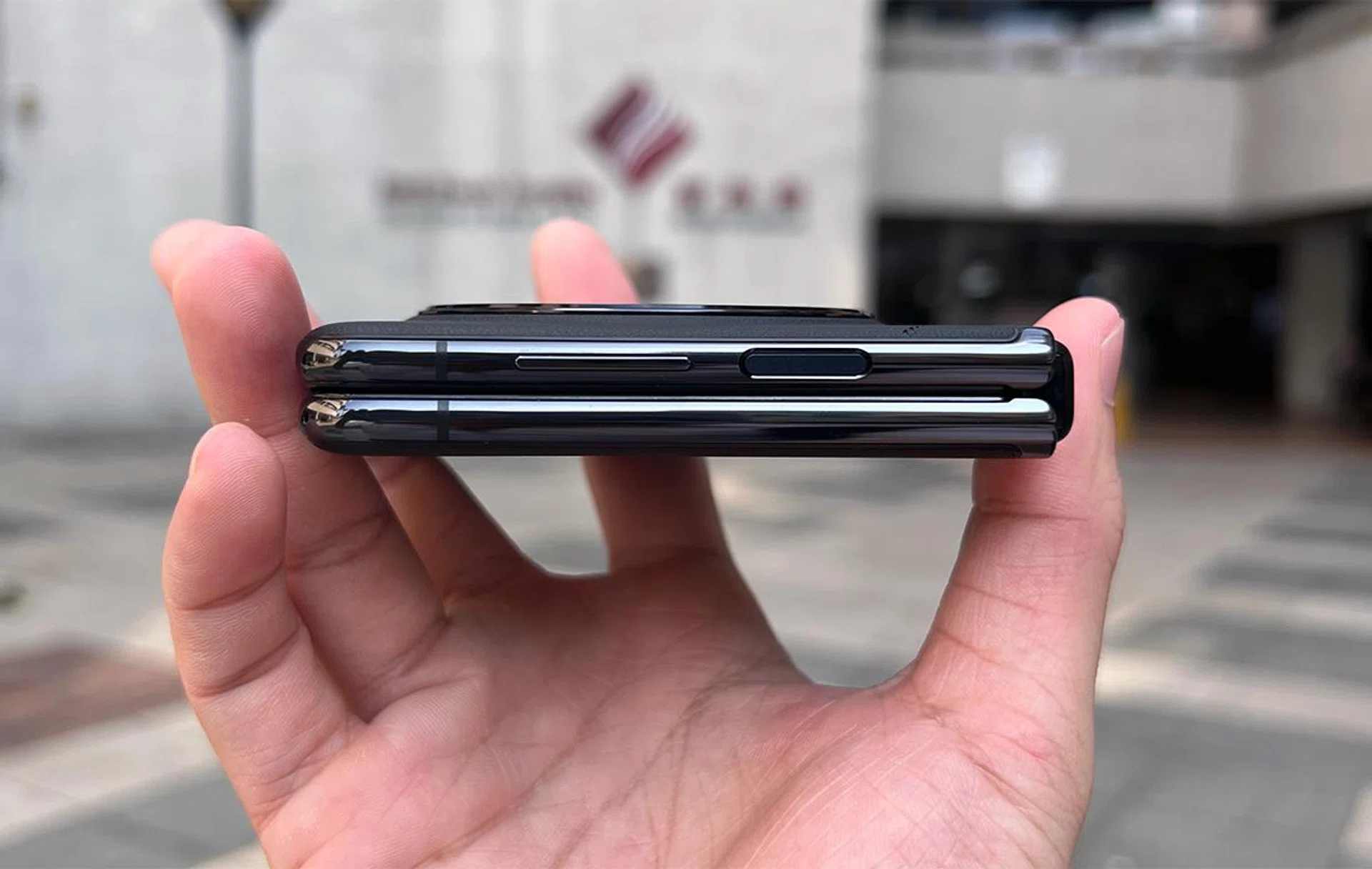 The camera lenses are flushed, and the housing island barely rises above the rest of the phone.