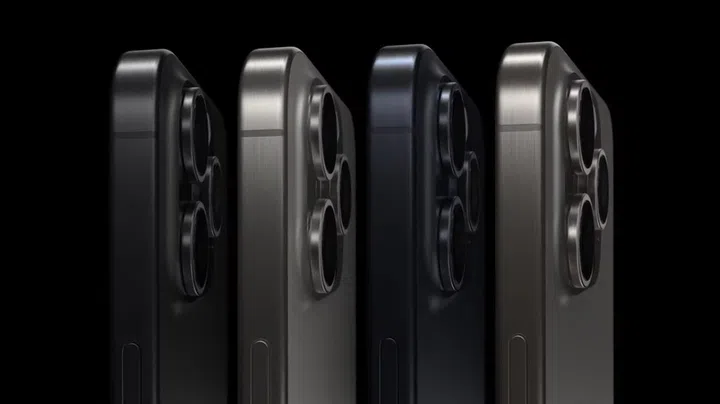 iPhone 15 Pro in Black Titanium, White Titanium, Blue Titanium, and Natural Titanium colourways.