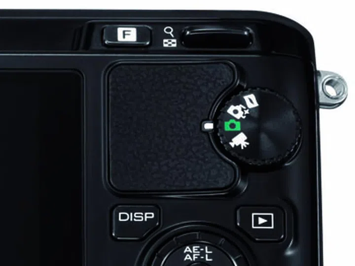 The mode dial on the back of the Nikon V1, missing the PASM modes that serious shooters prefer.