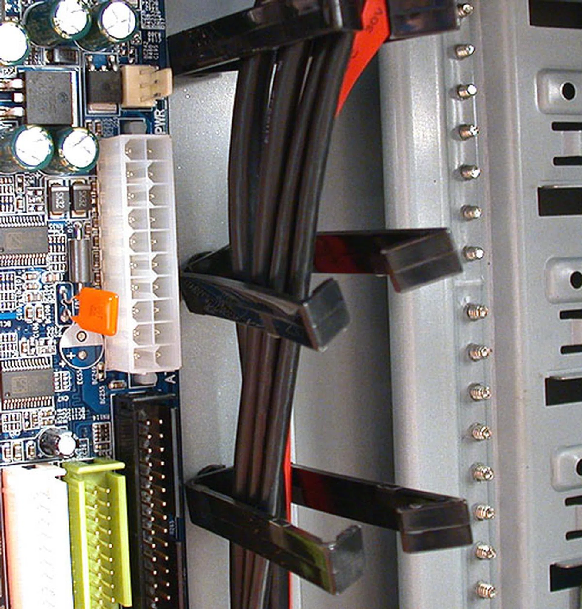 These plastic cable management tools help in getting those cables straightened out but they did seem a bit too close to the motherboard for our taste. 