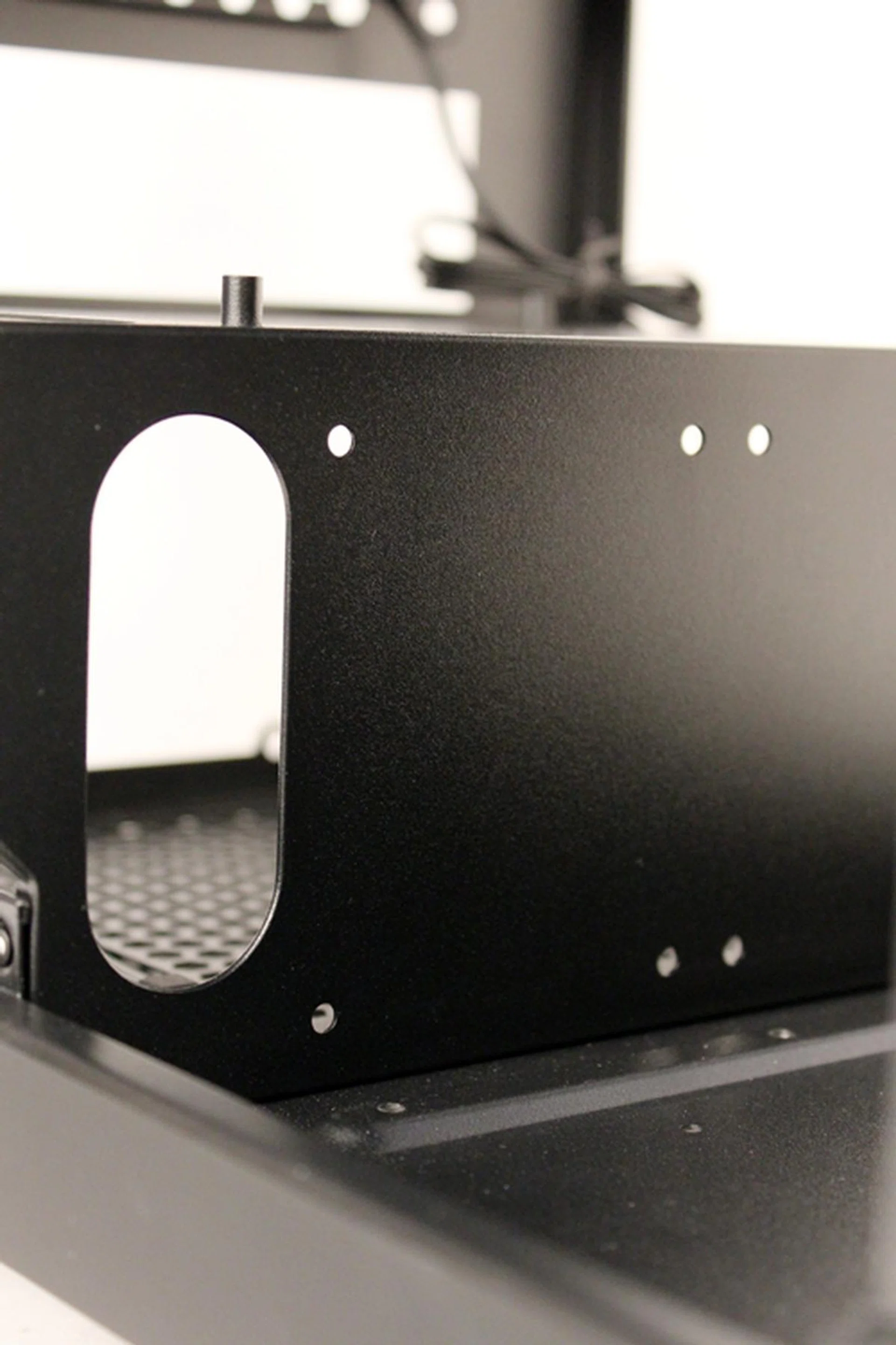 We can see the screw holes for the mounting of the 2.5-inch HDDs. The cut-out on the left is for the power cables of the PSU.