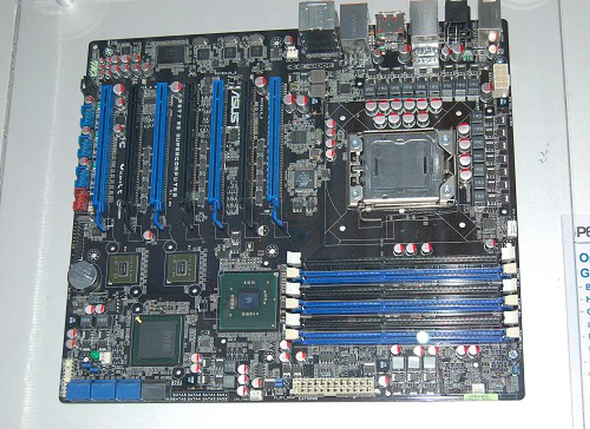 Supporting the Core i7 processor and the upcoming workstation Nehalem processor, this Intel X58 motherboard is built for workstation needs and is named P6T7 WS Supercomputer. Using dual NVIDIA NF200 chips, it supports SLI and CrossFireX. The board has 7 PEG slots, four operate at x16, while three more operate at x8. Besides the onboard SATA storage, there's also dual SAS RAID capable ports and dual eSATA RAID capable ports thanks to Marvell's controller chips integrated.  