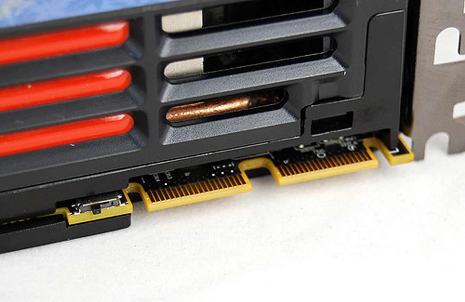 Both the Radeon HD 6970 and HD 6950 will have two CrossFireX connectors, meaing a 4-way CrossFireX configuration is possible. The new Radeons also come with dual BIOS and the little switch to left lets users toggle between the BIOS.