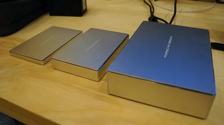 LaCie's Porsche Design Mobile Drives (left and center), and the LaCie Porsche Design Desktop Drive (right).