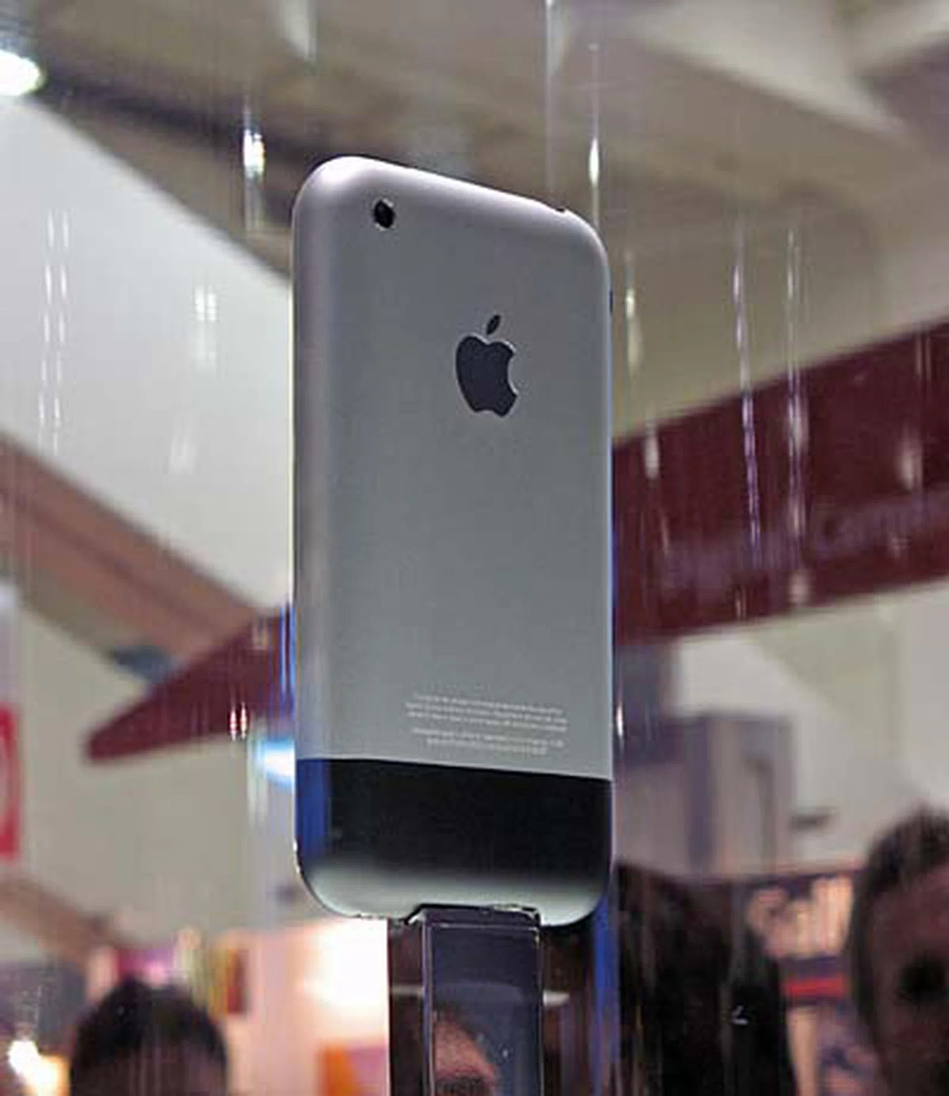 On its rear, you can see the 2-megapixel camera on the top left corner. The headset port and the sleep/wake button reside at the top. The "iPod" connector is found at the bottom.