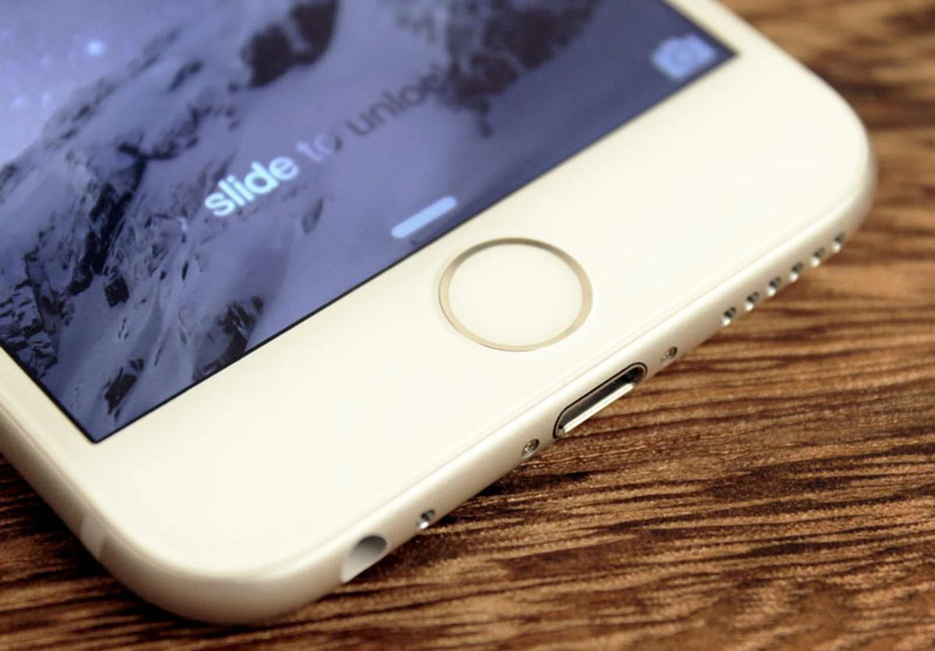 Like the 5S, each Touch ID button is ringed in a color-matched metal band.