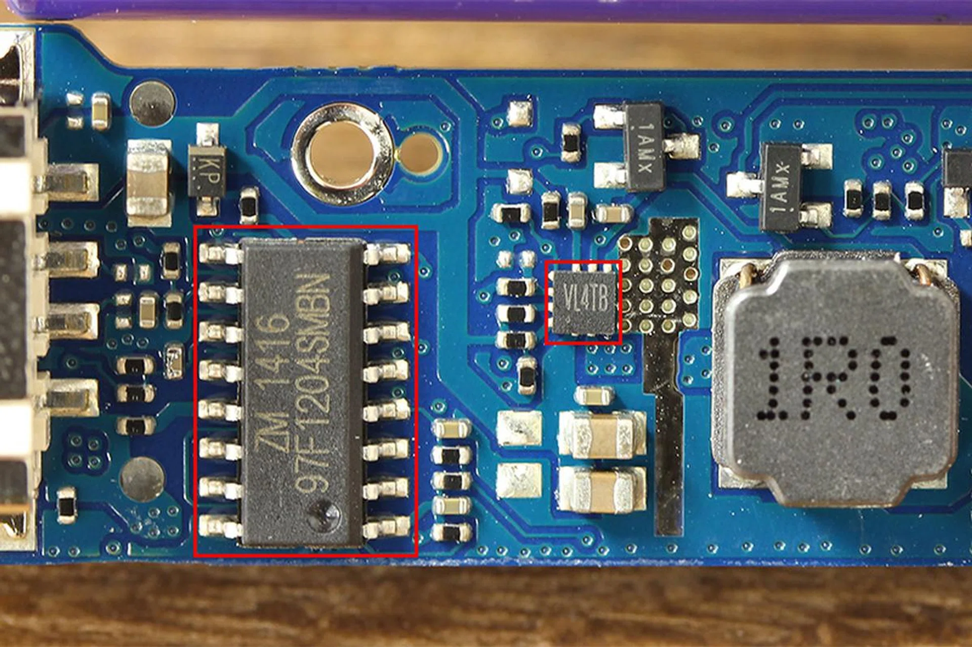 The ABOV 97F1204SMBN microcontroller and the mysterious VL4TB chip, which is likely to be the Silergy SY7065A charging IC.