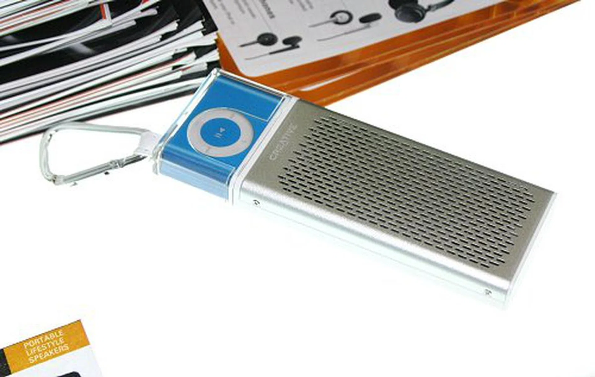  If you can't beat them, join them. Creative takes a stab at making Apple's success work for them with the TravelSound i50 travel speakers that are made for the iPod shuffle. The i50 can work for up to 15hrs with its four micro driver speakers. Comex offers have been spotted at S$79 (iPod not included of course).  