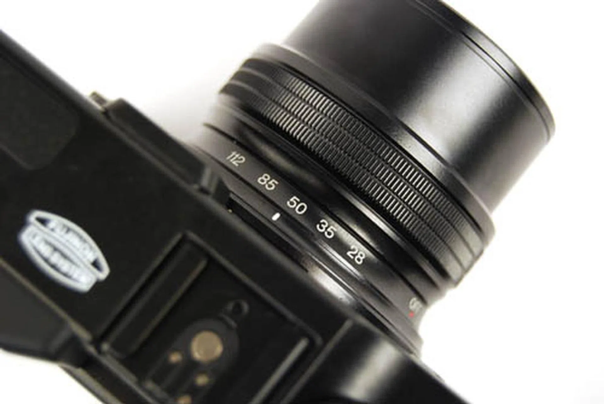 Unlike some other cropped sensor lenses, the focal length markings on the X10 are in 35mm equivalent. Very useful.