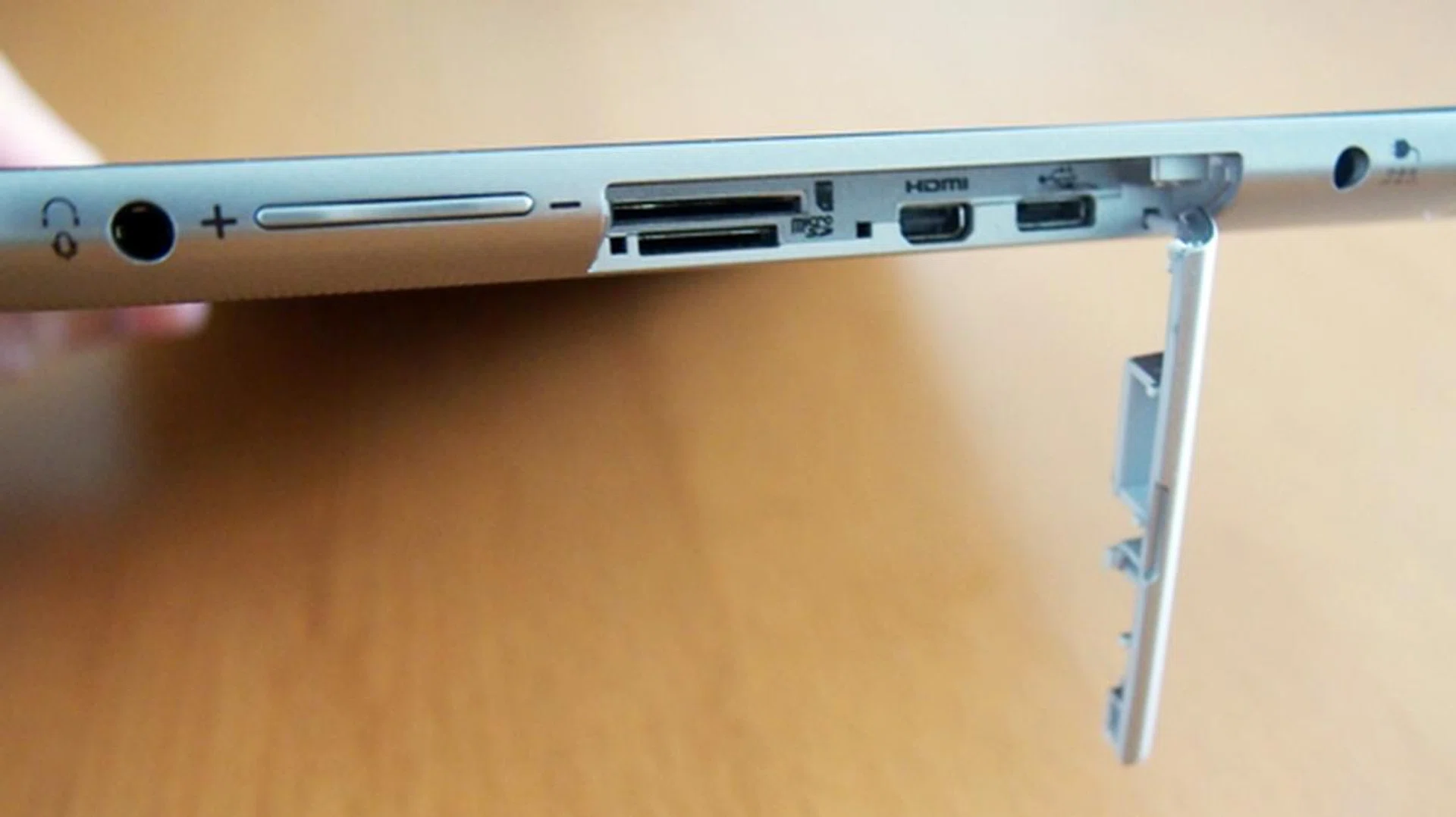 From left to right: 3.5mm audio output jack, volume controls, SIM (standard size) and microSD card slots, micro-HDMI and micro-USB ports, and the proprietary charging port.