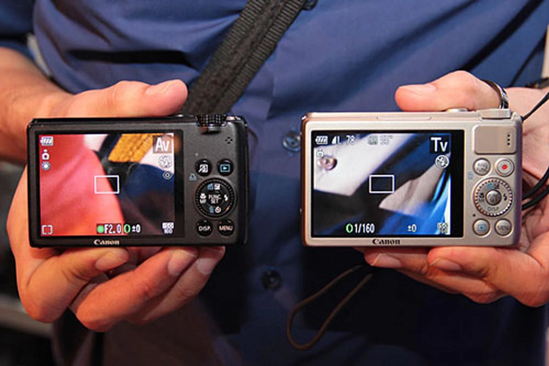 Here's a comparison shot from the back. Notice the small thumb rest for the S100. 