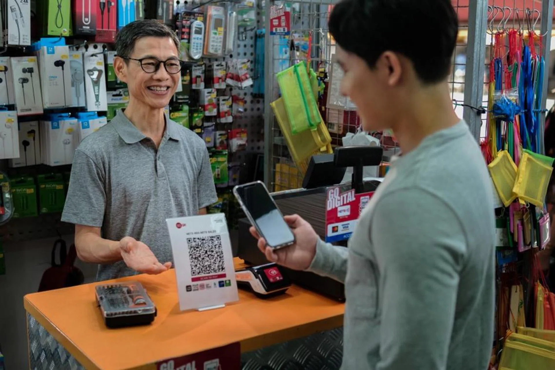 The upgraded SGQR+ onboards more financial institutions, more merchants, more hawkers, and more payment methods. The only missing piece of the puzzle is having more money to spend. Image: NETS. 