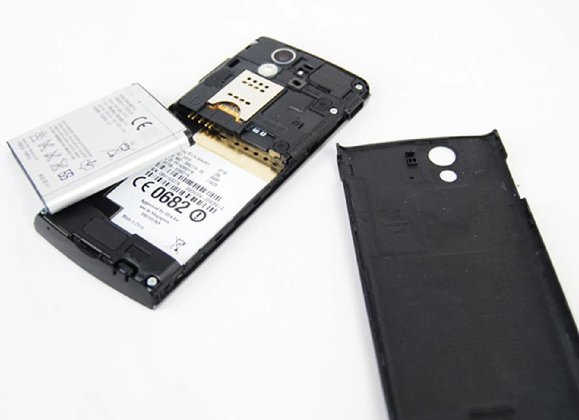 The back cover is easy to pry open; simply lift it up from the small opening at the bottom of the phone. The usual suspects are found here: compartments for the battery, microSD and SIM cards. Unfortunately, you can't swap either card out without removing the battery first.