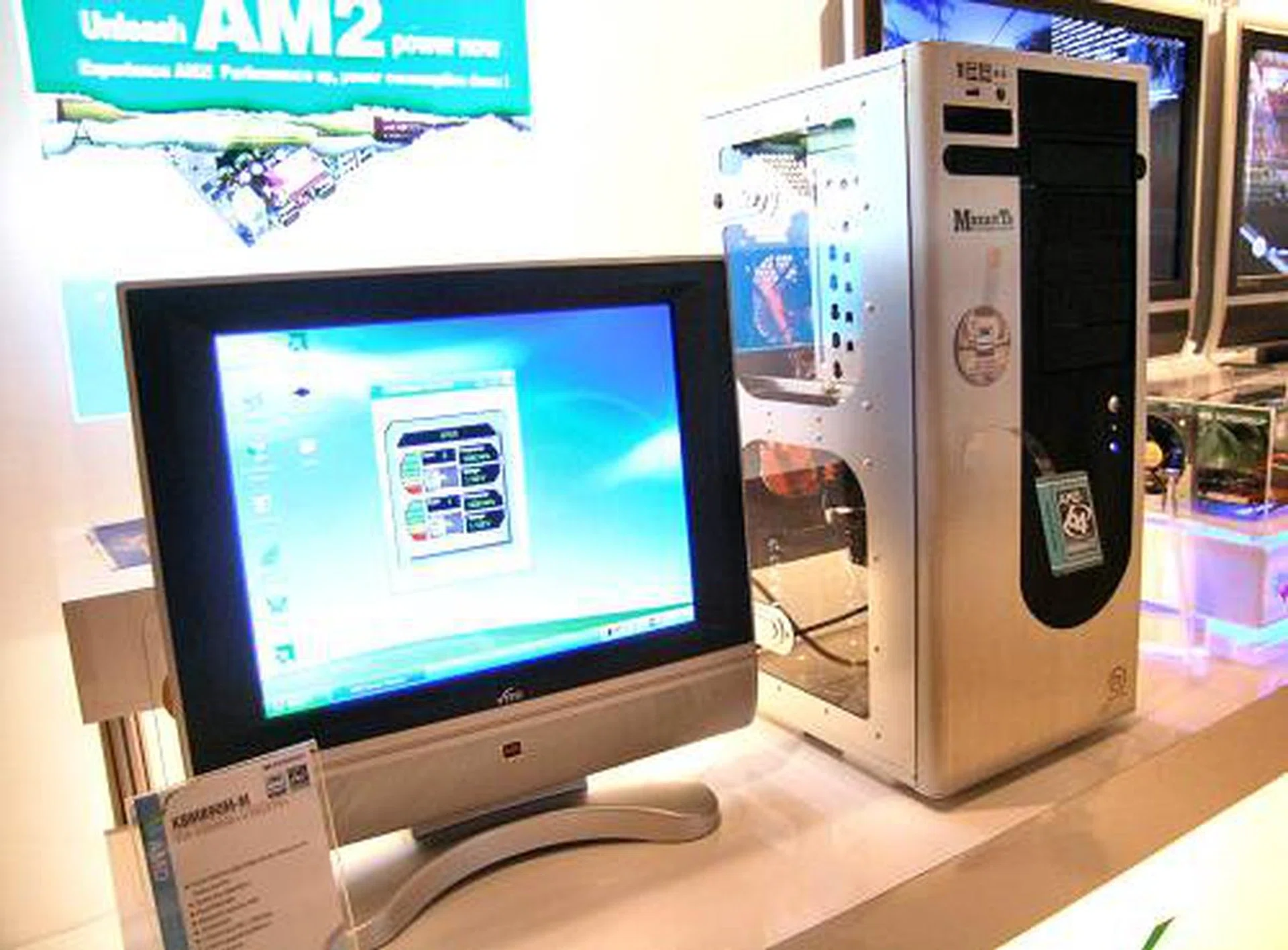 ECS seemed to like Thermaltake's new Mozart TX cube tower casing very much as they've even got a demo running with a two-board setup. On one side, we have a full 'gaming' system running on an energy efficient 65W TDP AMD Athlon 64 X2 4800+ and on the other side, a mini ITX setup for home entertainment.