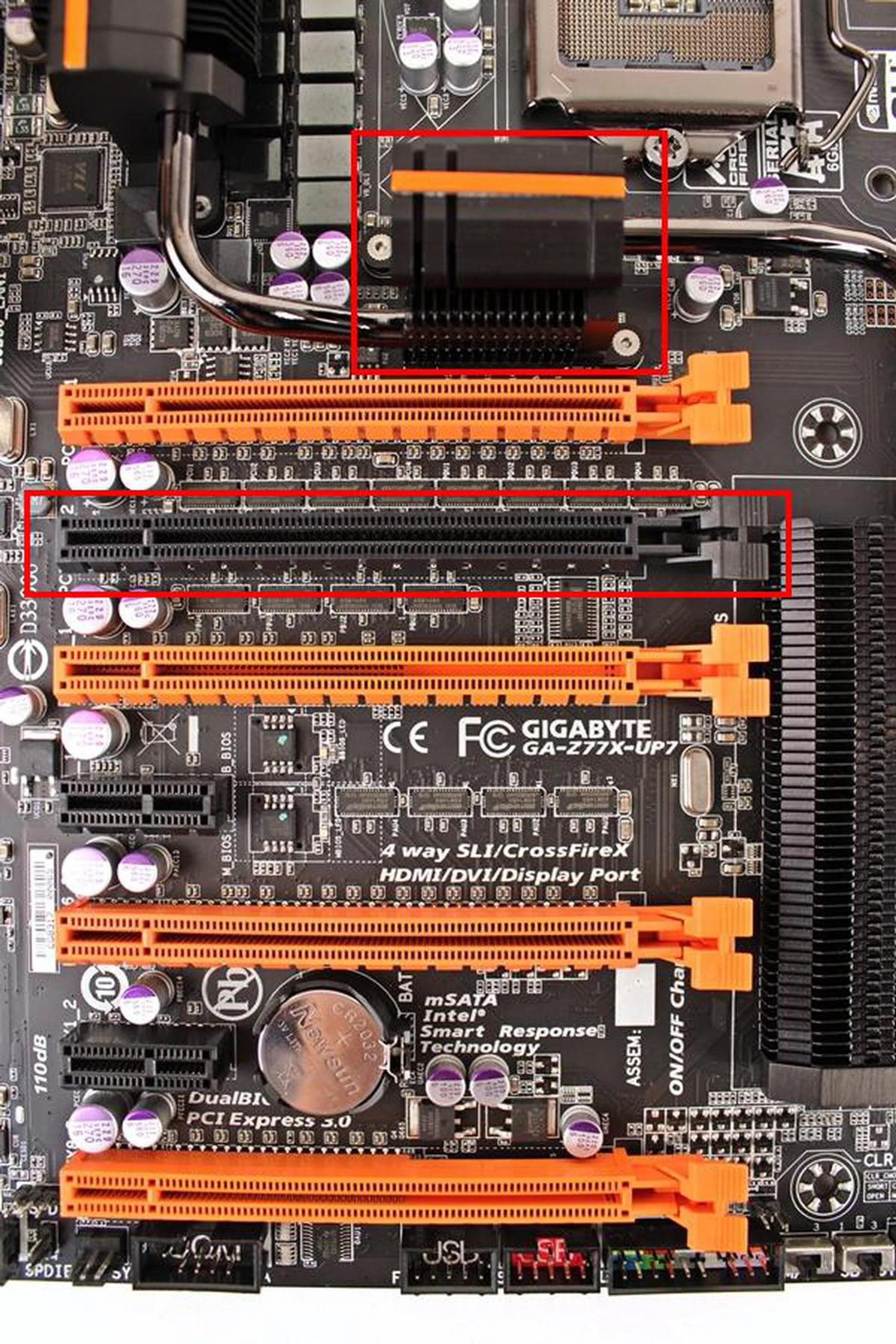 The four orange PEG slots that are able to provide four-way graphics support due to the presence of a PLX PEX 8747 switching chip that feeds each of the PCIe Gen 3.0 x 16 slot with up to eight lanes of PCIe Gen 3.0 connectivity in a four-way graphics cards setup.
