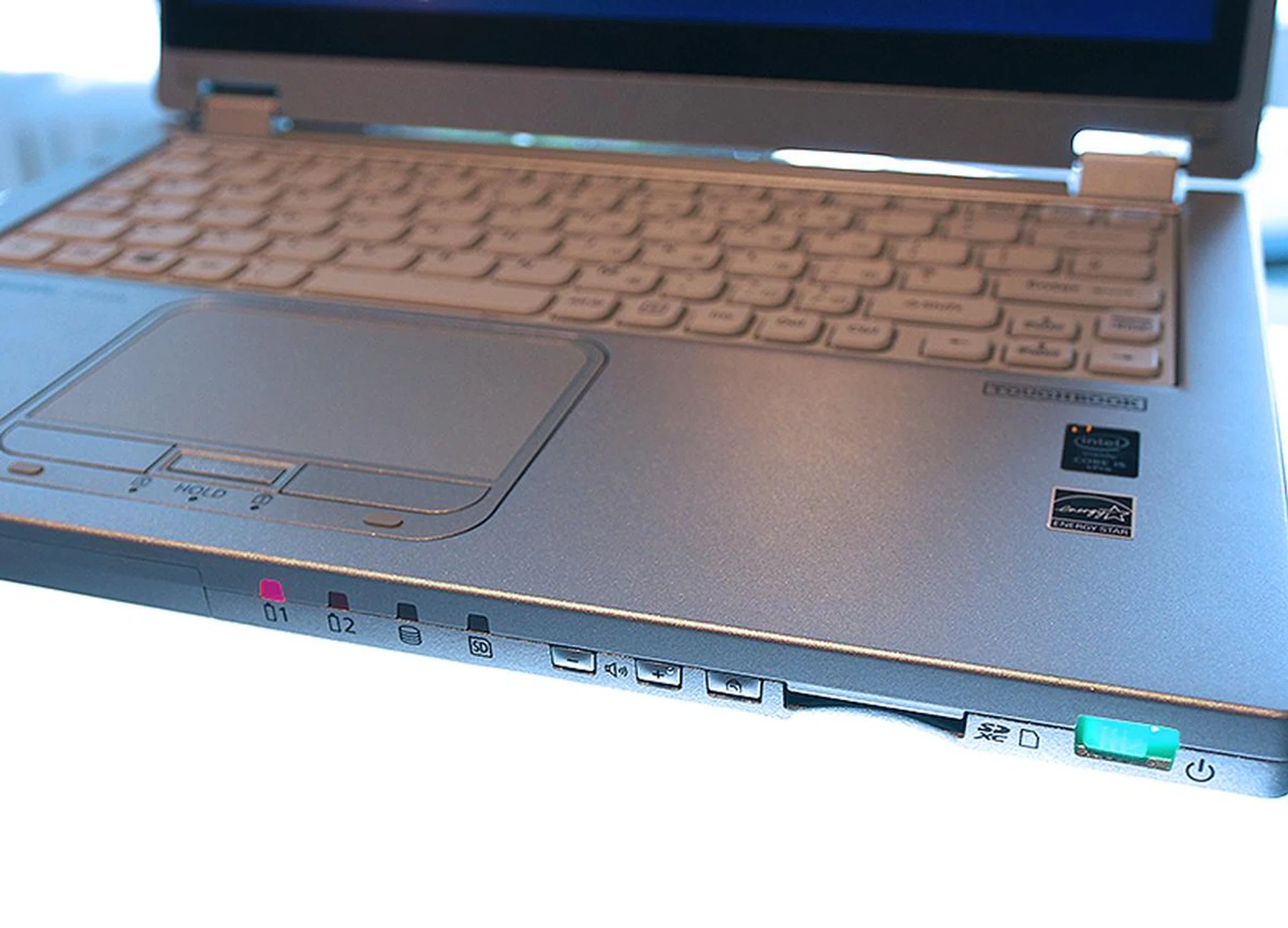 Large LED status indicators and a huge power switch adorn the front side of the notebook.