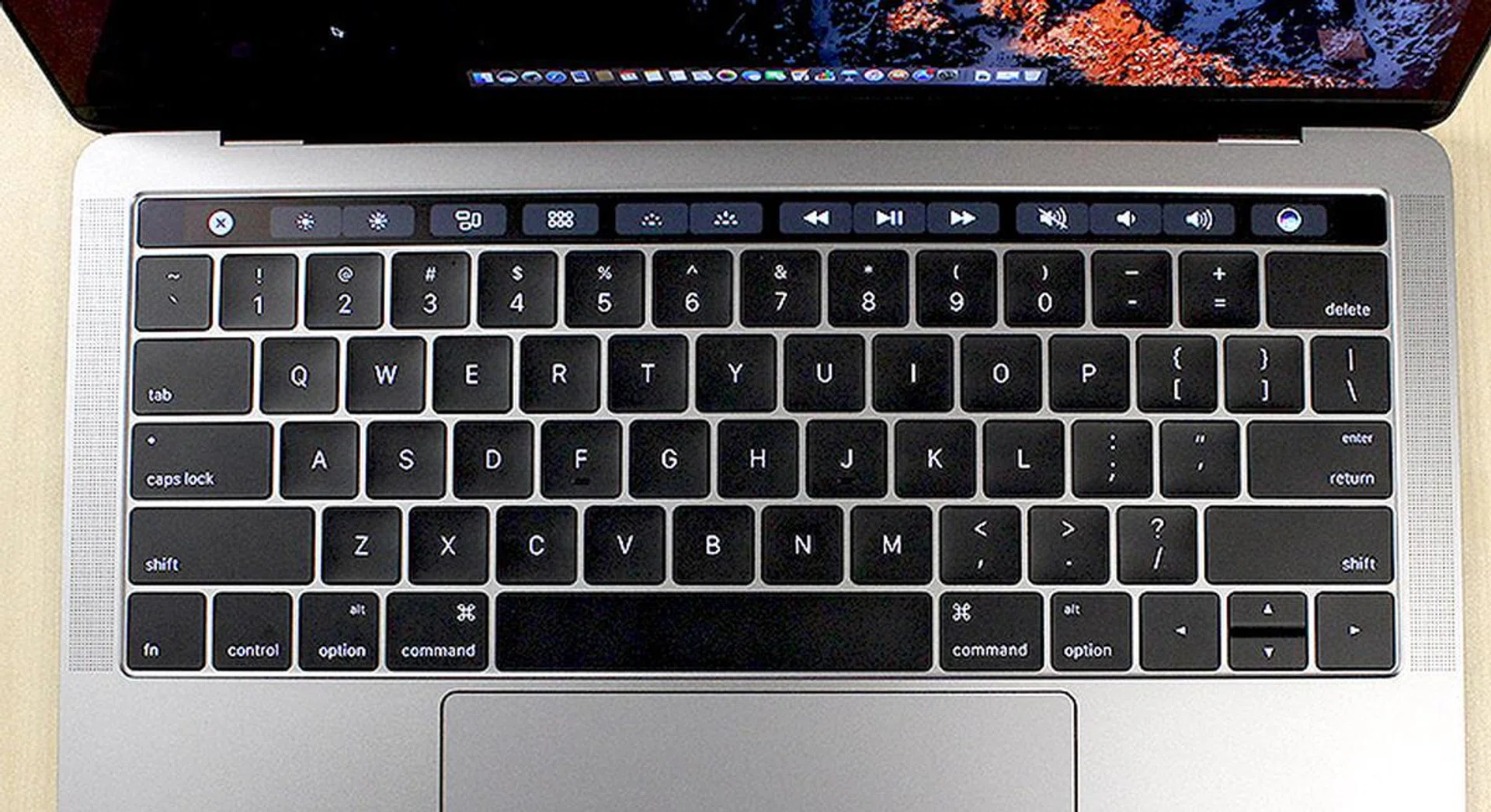 The Touch Bar sits above the keyboard and replaces the traditional function and media shortcut keys.