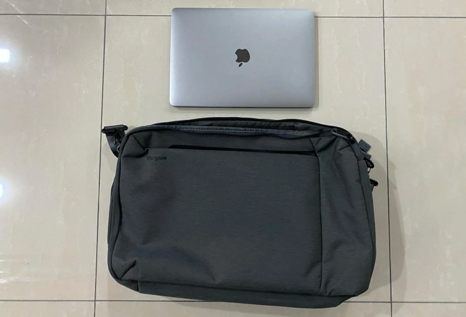 Size comparison between the Cypress Convertible Backpack and a 13-inch MacBook Pro.