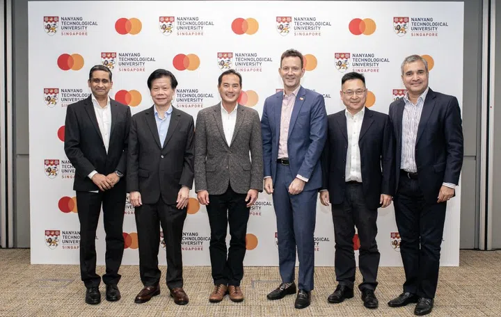 Karthik Ramanathan, Senior Vice President, Cyber & Intelligence Solutions, Asia Pacific, Mastercard; Professor Lam Khin Yong, Vice President (Industry) of NTU Singapore; Senior Minister of State Tan Kiat How, Ministry of Communications and Information; Matthew Driver, Executive Vice President, Head of Services, Asia Pacific, Mastercard; Professor Lam Kwok Yan, Executive Director, Digital Trust Centre, NTU Singapore; Ari Sarker, President, Asia Pacific, Mastercard, celebrating the successful industry-academia collaboration to strengthen cyber expertise in Asia Pacific. Image source: Mastercard.