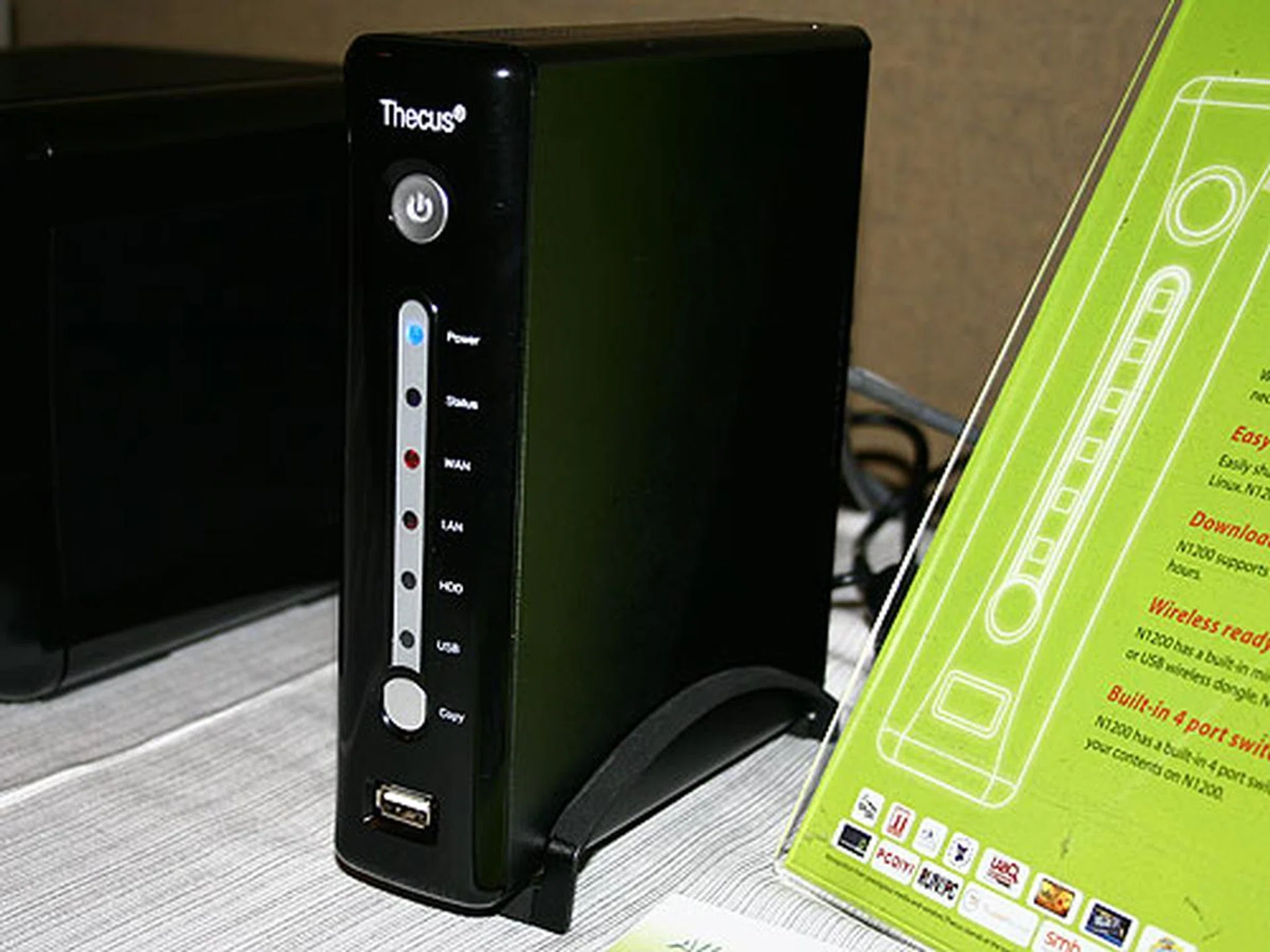  The Thecus N1200 is a single drive NAS device that supports either 2.5- or 3.5-inch hard disk drives. It comes with an eSATA port for immediate storage expansion and it also comes with a 4-port Fast Ethernet switch that lets you connect more devices to it. Its software supports serving video, audio and photo files as well as FTP, HTTP and BitTorrent scheduled downloads.  