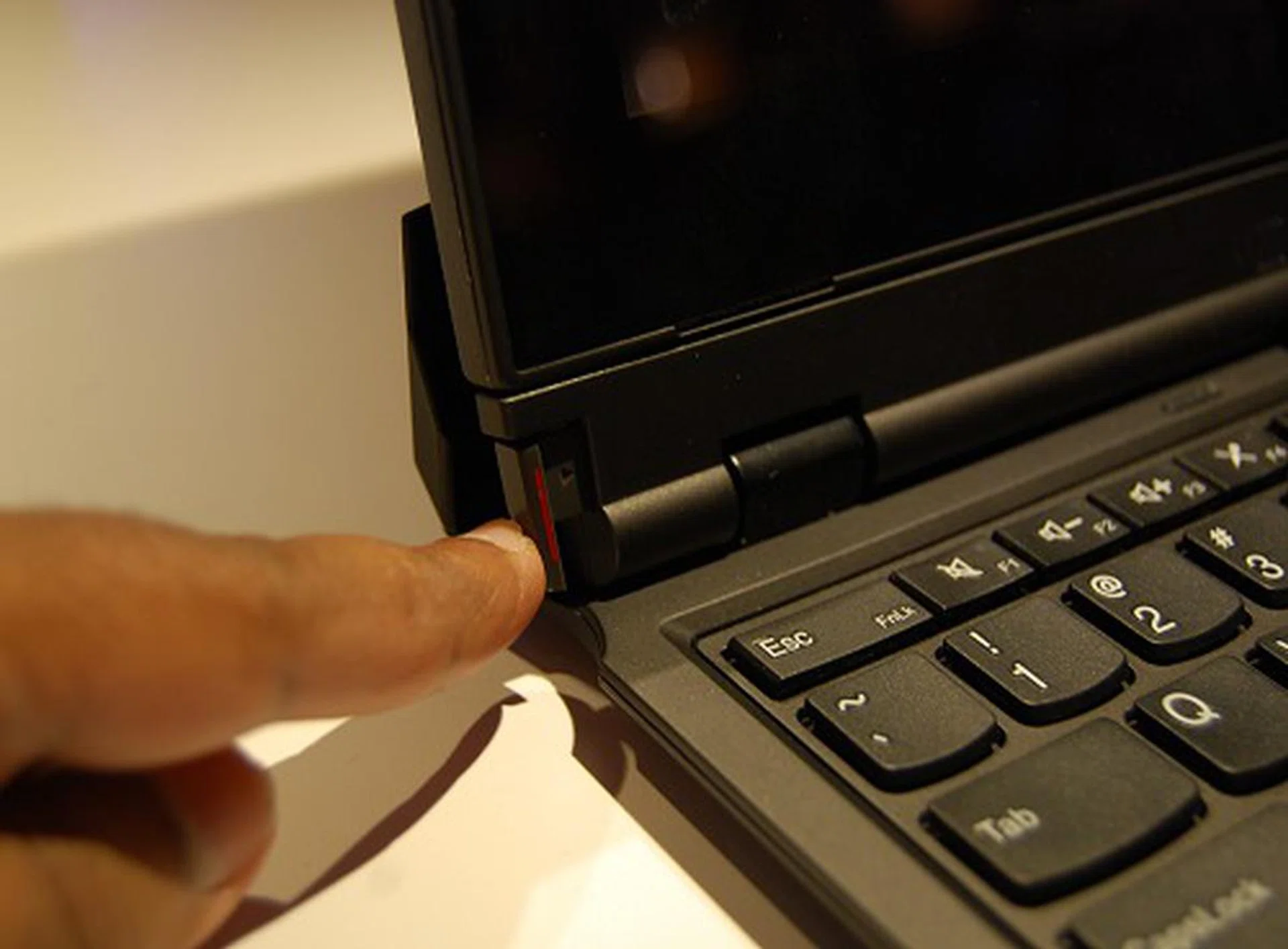 The screen is easily detached by pushing a release mechanism on the bottom left of the notebook. 
