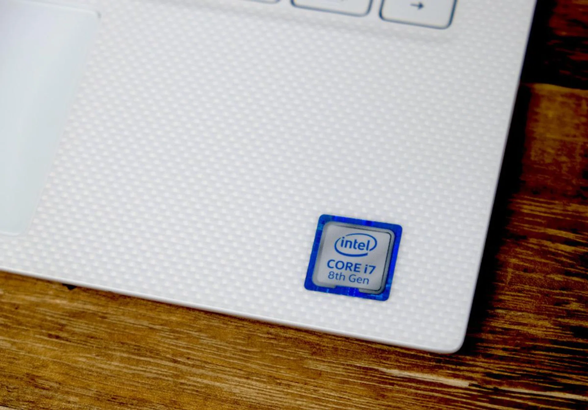 The rose gold model of the XPS 13 has a unique white woven glass fiber palm rest.