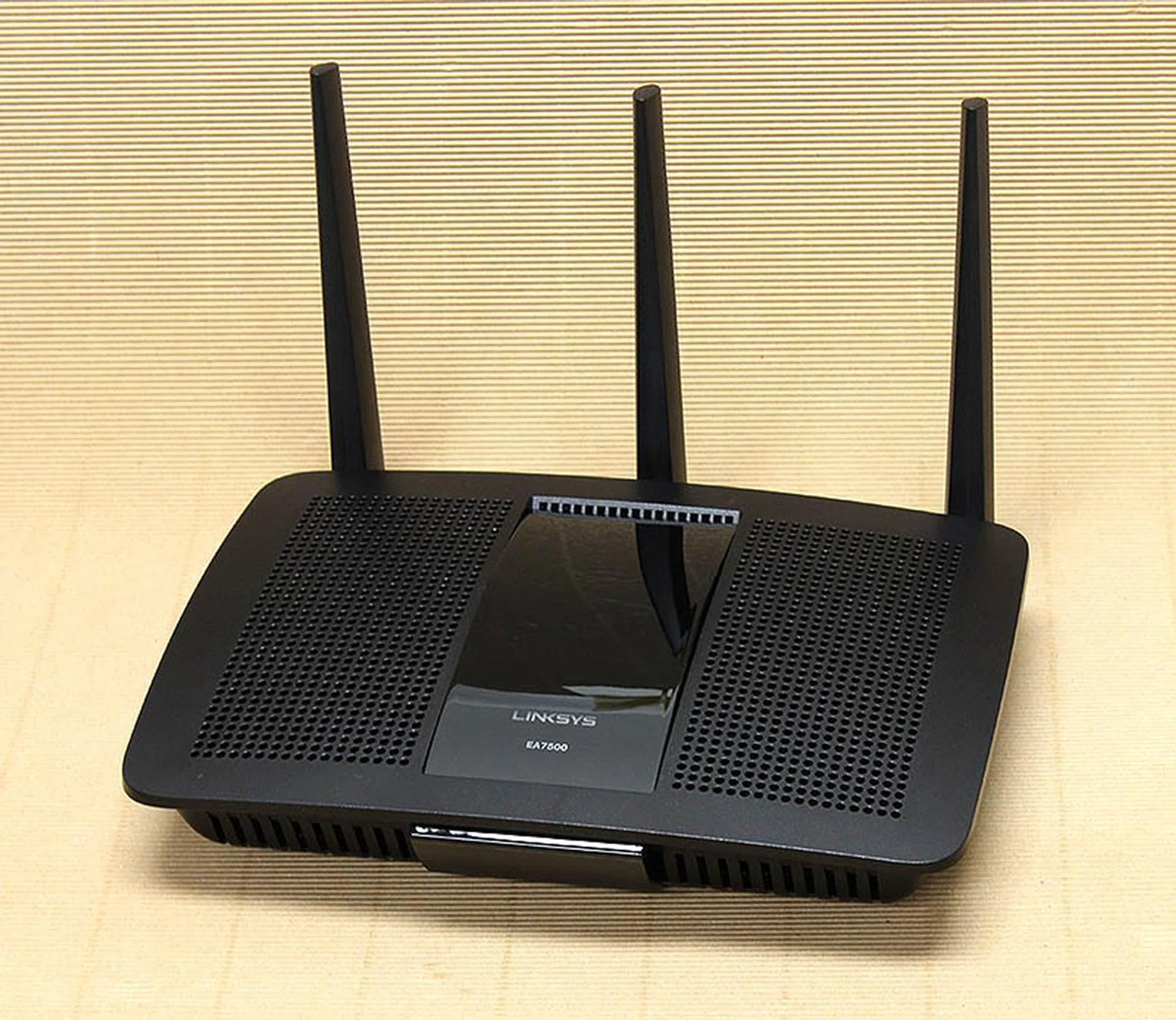 The Linksys EA7500 router looks just like the EA8500 router, but with one less external antenna.