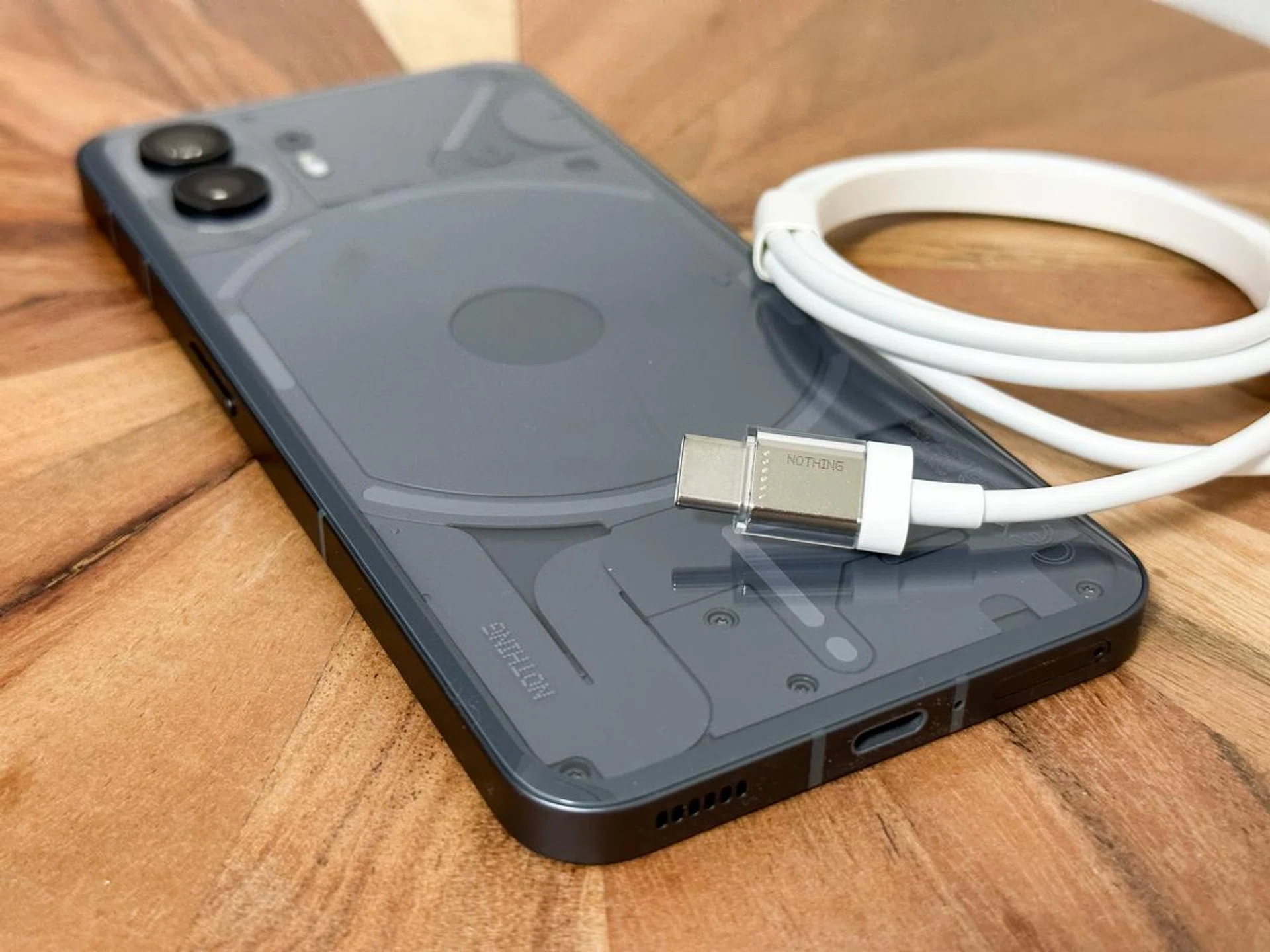 Nothing Phone (2) with the transparent charging case included in the box.