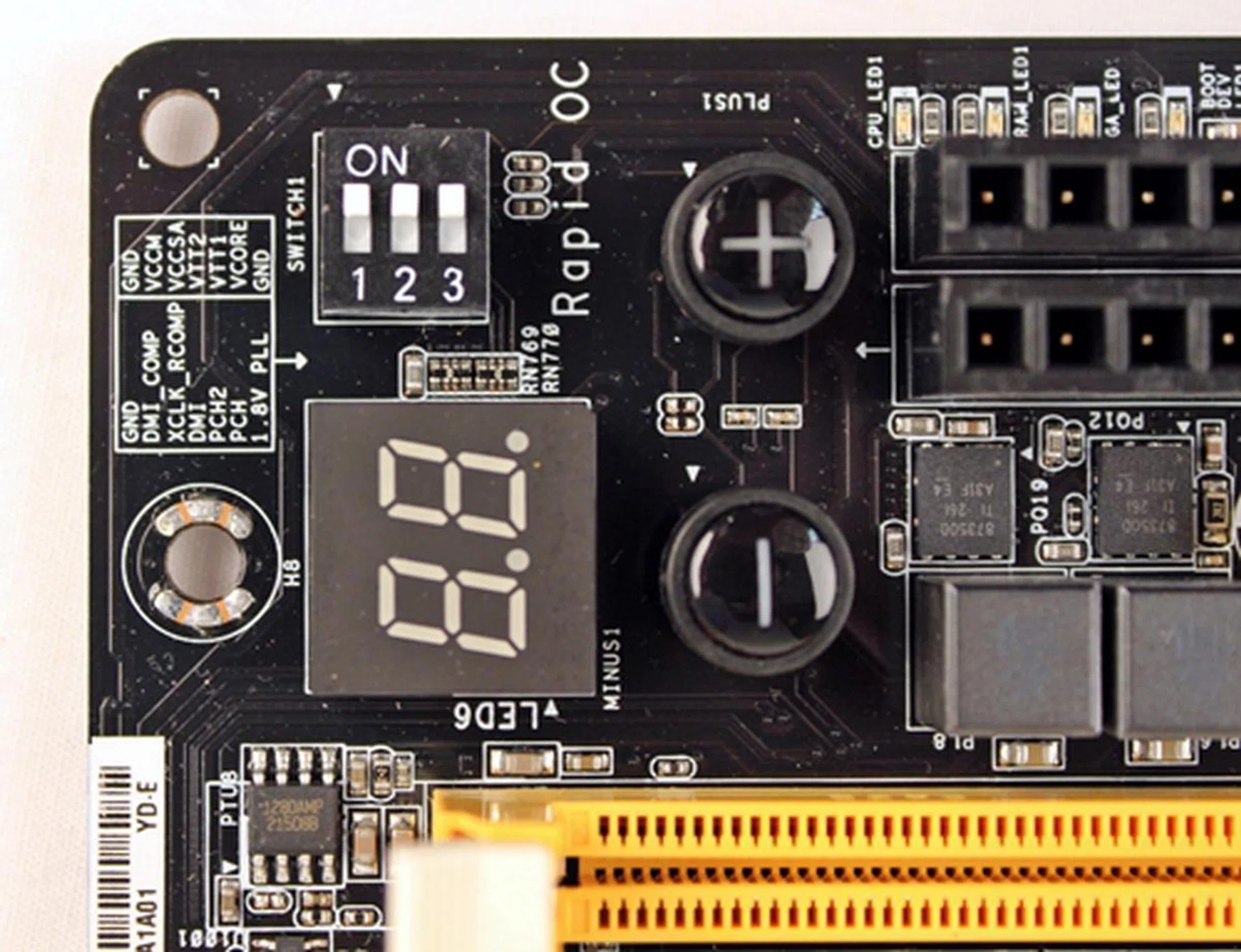 The PCIe DIP switch controls the three PEG slots with the numbers corresponding with the order of the PEG slots, from top to bottom. To its left is the quick silk-screened guide for the V-Probe's different contact points.