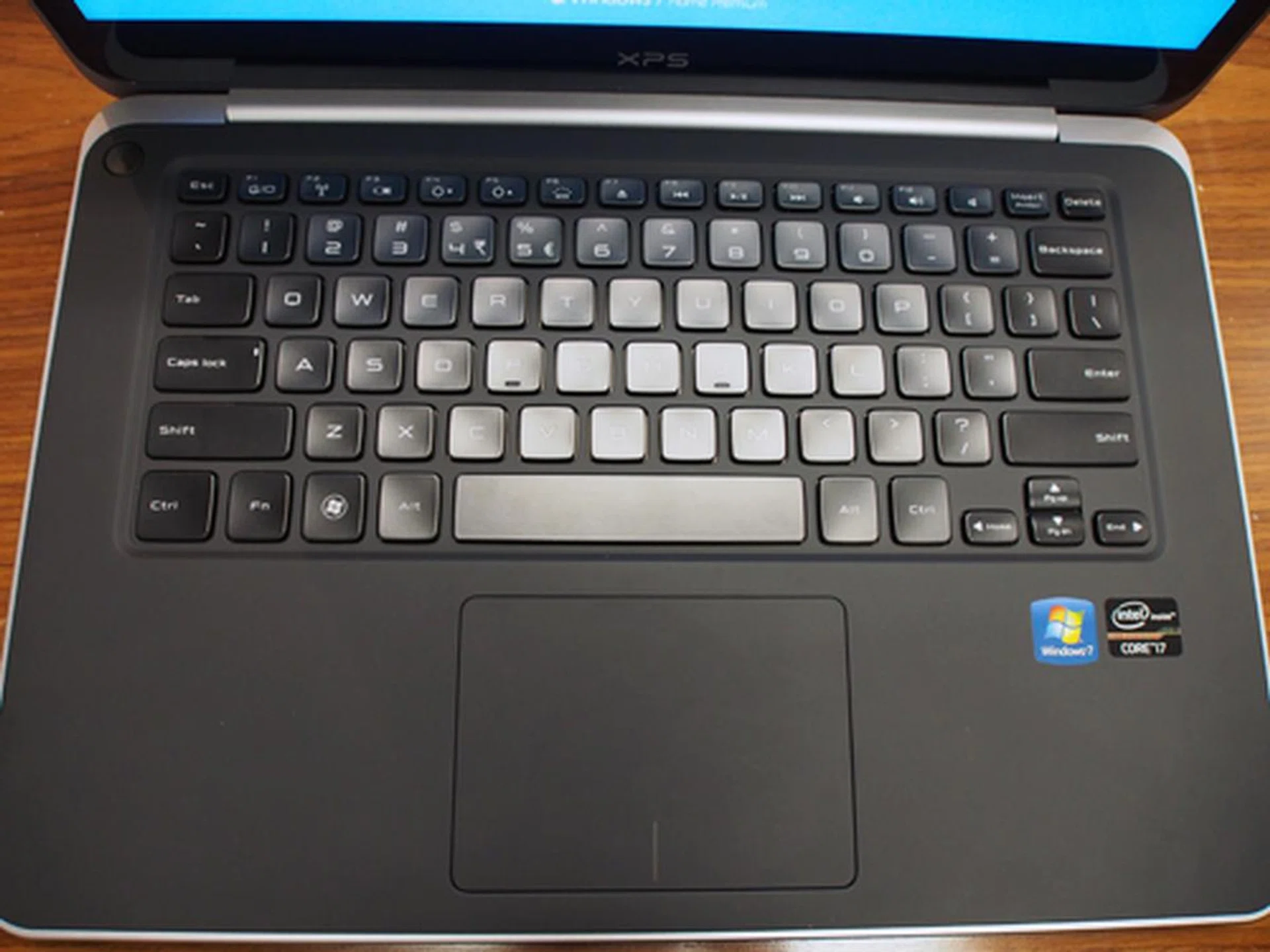 The XPS 13 uses a one piece interior, with a generously-sized glass trackpad.