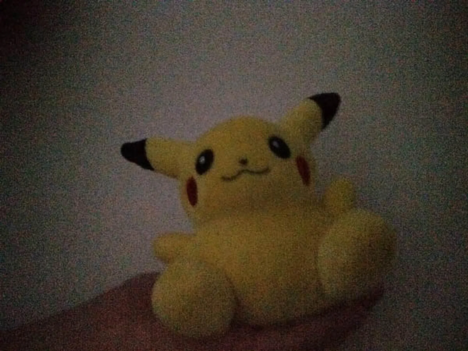 Pikachu taking a selfie again. Note that there is a lot of noise in the photo