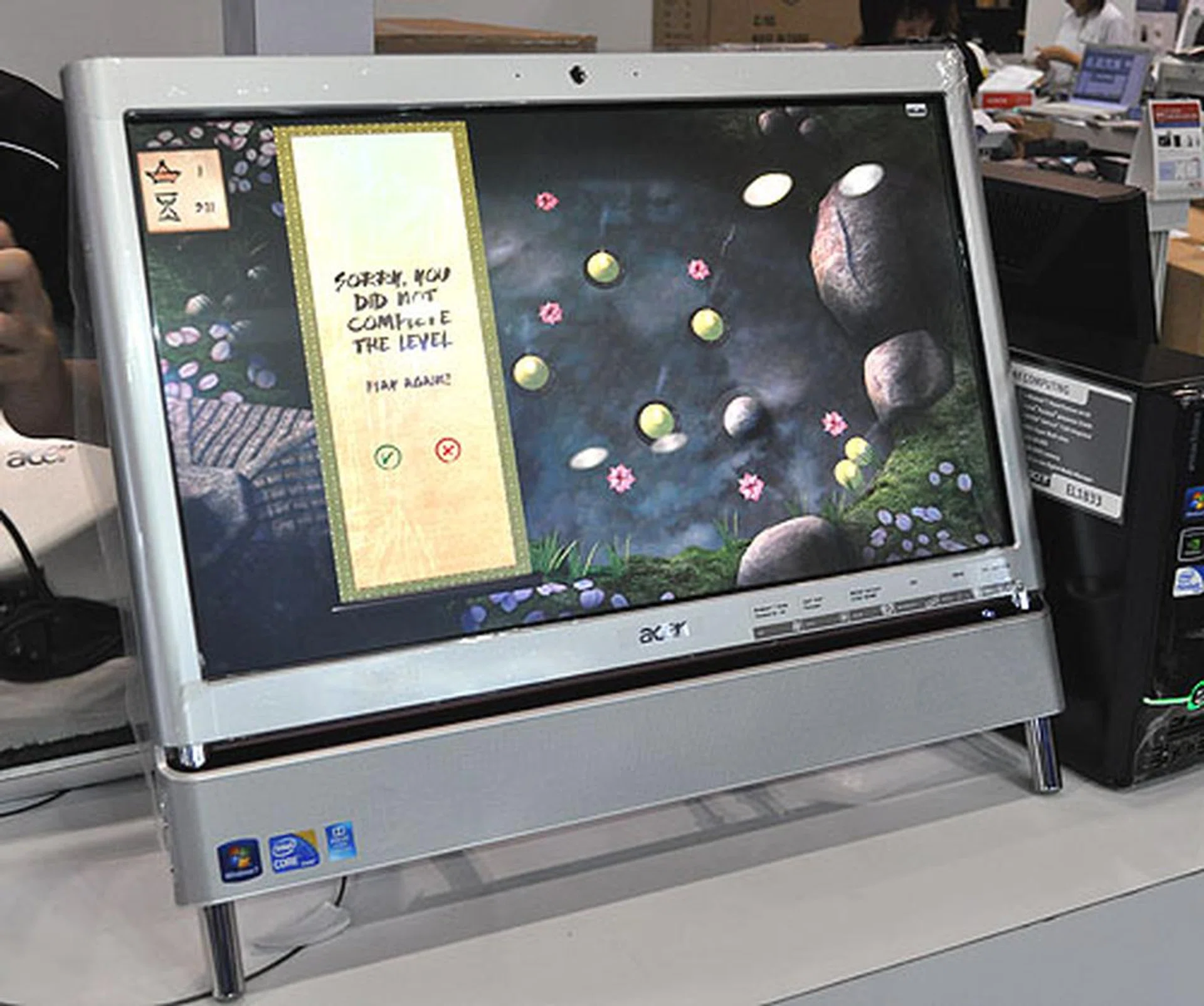 Acer has a few AIO Touch PCs on show, but this Z5610 is limited to just 100 sets. It's an older model though with an Intel Core 2 Quad Q8400 CPU with NVIDIA's GeForce GT210M graphics. You'll find 4GB of memory with a 1TB HDD and a full 23-inch full HD multi-touch screen. It's going for $1699 