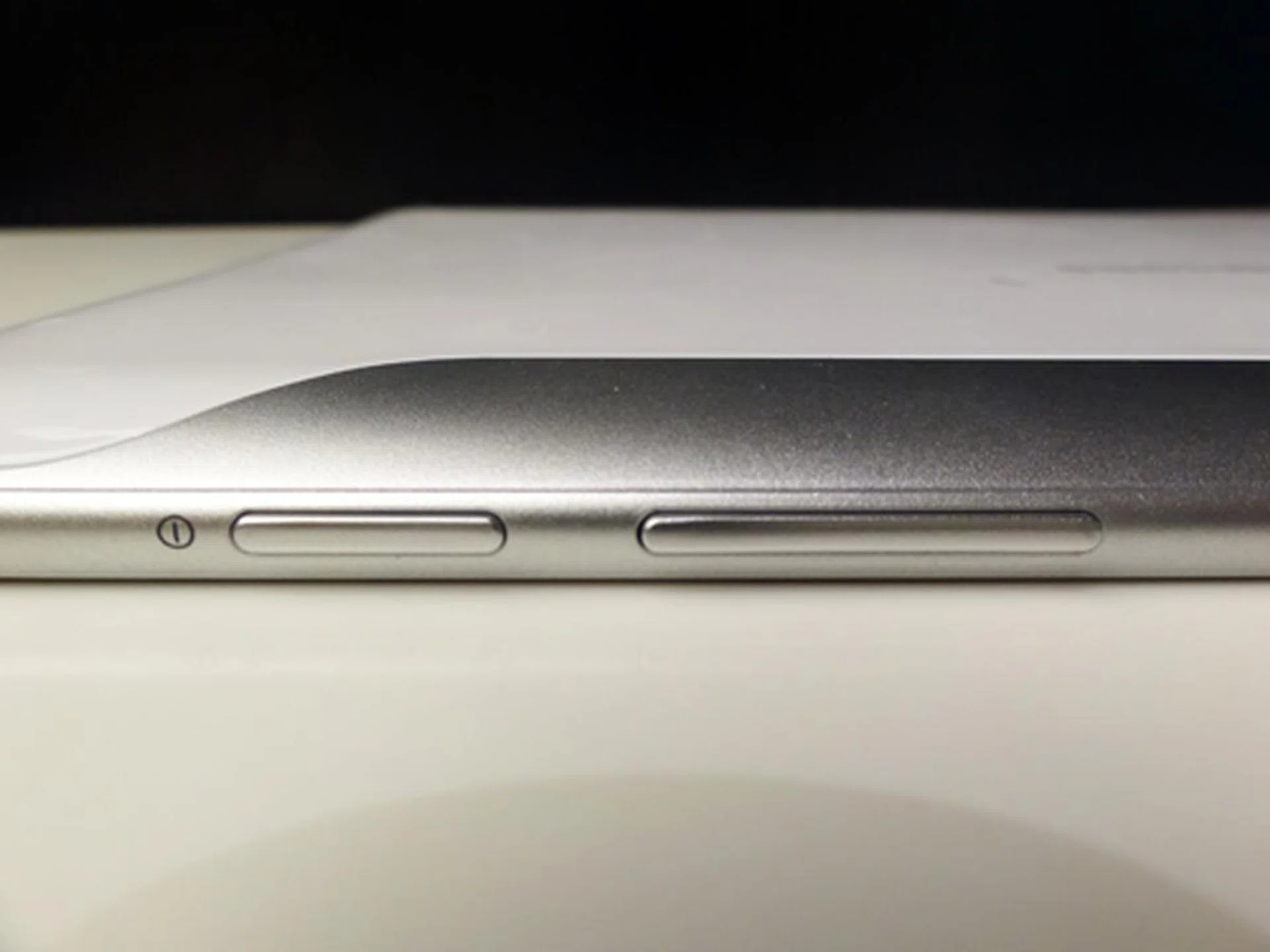 The top is where the action is: faced down from left to right, we have the power button, volume controls... 