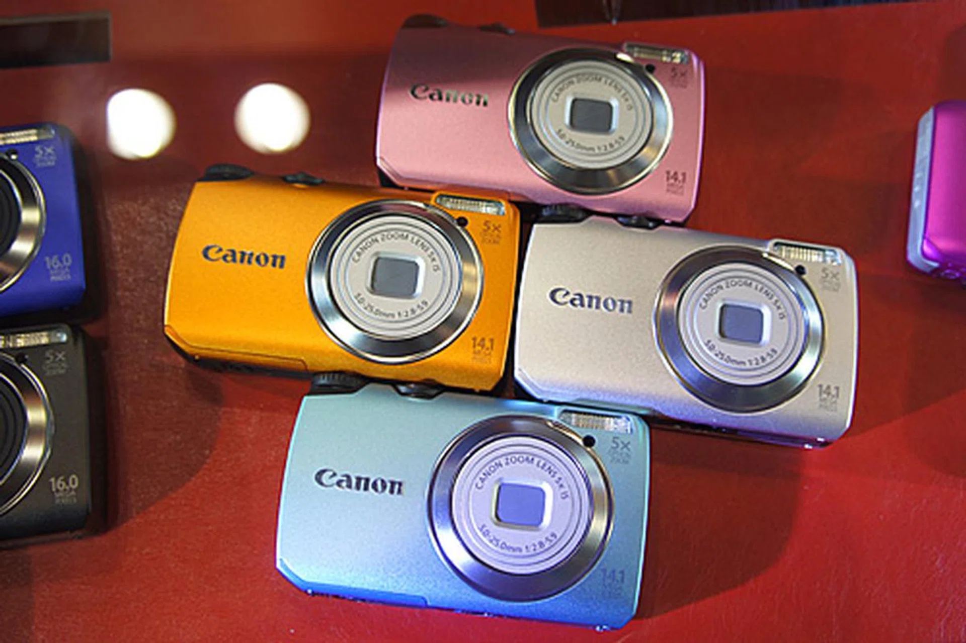 The 14.1-megapixel PowerShot A3200 IS comes with a 28mm lens with 5x optical zoom, a 2.7-inch LCD, a Smart Auto mode, and a Discreet mode. It also does 1280 x 720 HD movie recording. It's going for $249, and freebies include two 8GB SD cards.
