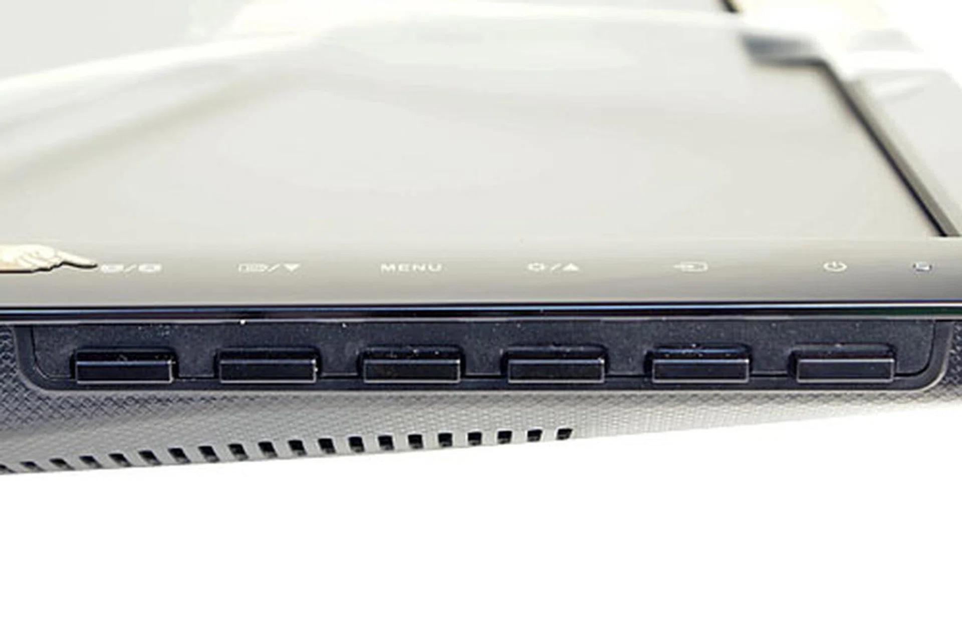While the labels of the controls are silkscreened along the bottom bezel, the controls themselves are tucked under the frame. We are relieved to see tactile buttons, instead of touch controls.