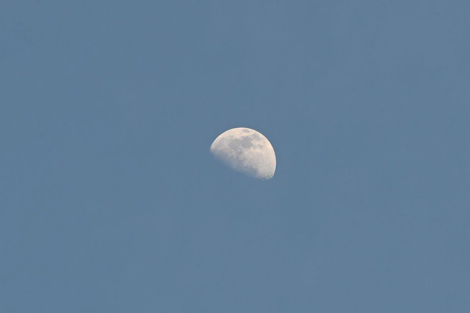 Even with a tight crop of 12 per cent, you can still see the crater details of the Moon. 