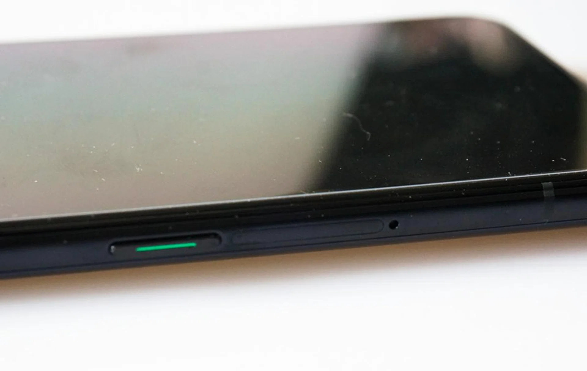 The SIM card tray is right next to the power button.