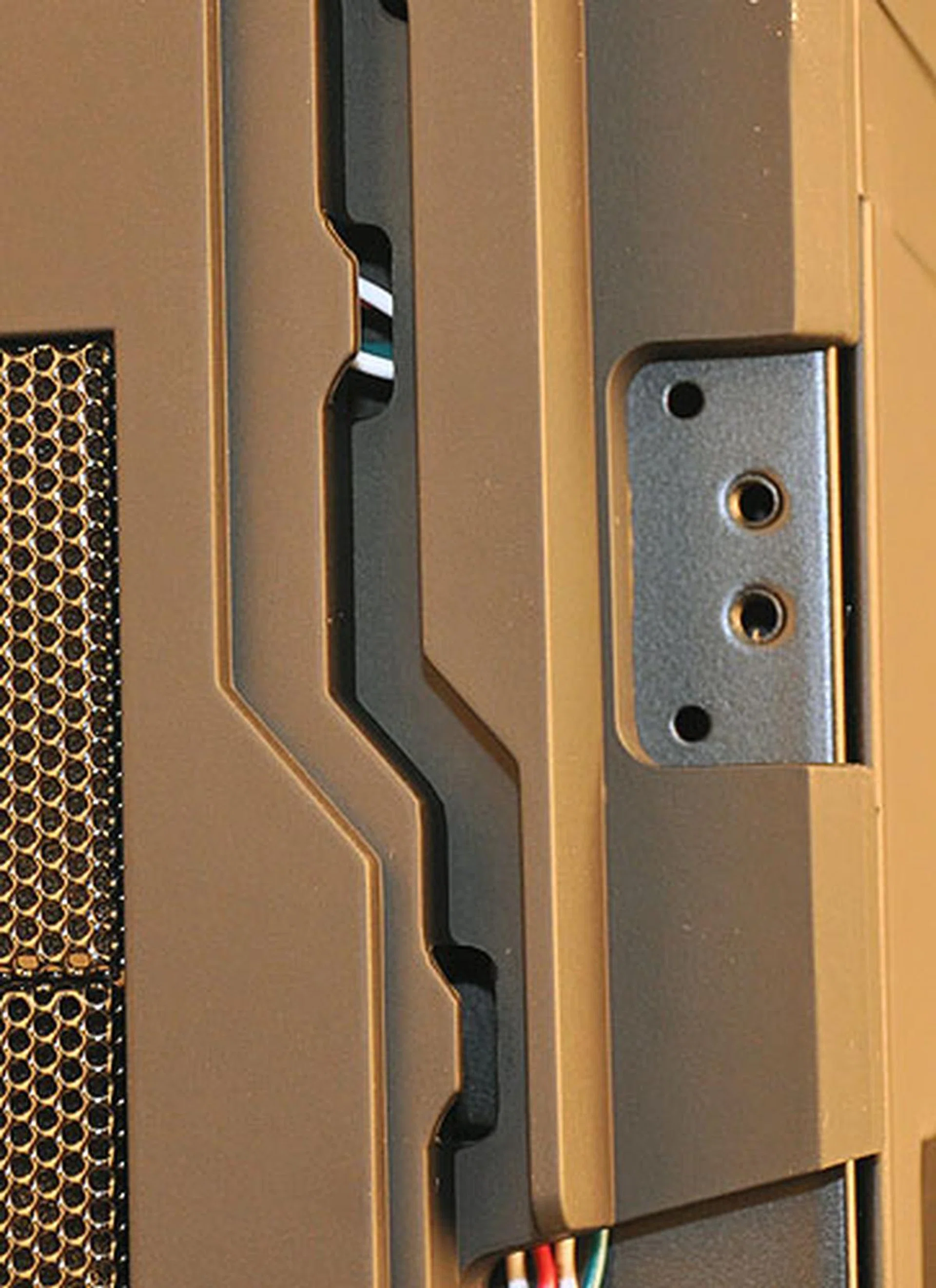 Remember that cable from earlier? Another rather unique feature on the Colossus is this cable management system for your gaming peripherals, where users can route the cable through grooves at the sides of the casing, assuming that you have plugged them into the front USB ports in the S3 compartment. Also, judging by the screw holes here, the front door which opens to the left, can be swapped to open to the right.