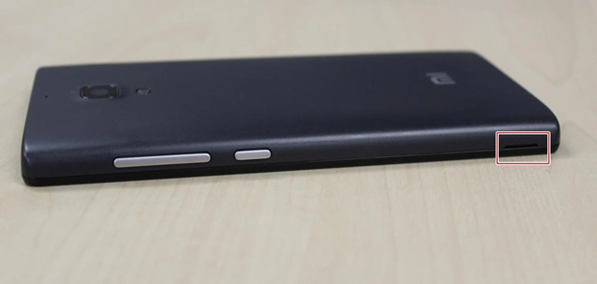 You won't require much strength to pry open the back cover from the bottom of the Redmi.