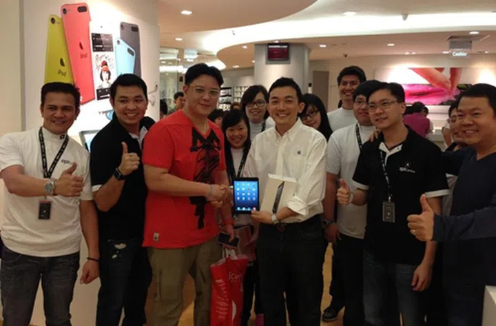 Terence, 34 (in red v-neck tee) was first in the queue at EpiCentre, Ion Orchard. Jimmy Fong (on his right), executive chairman and CEO of EpicCentre was present to congratulate Terence on his purchase.