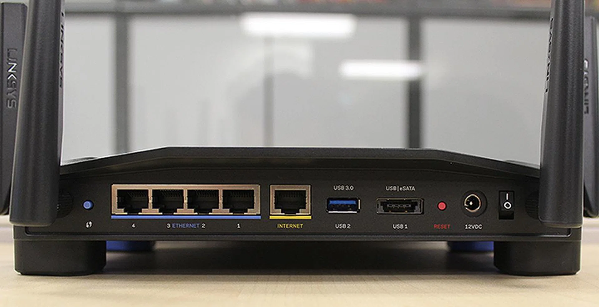 What is unusual about the WRT1900AC is that it can connect to eSATA devices. The small blue button to the left is for connecting to WPS-enabled devices.