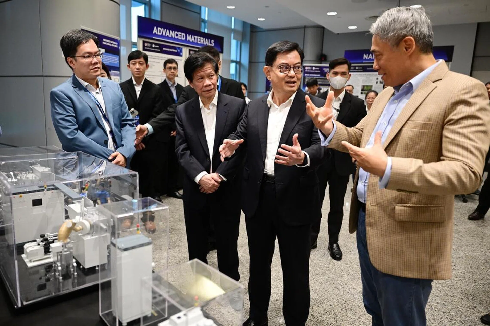 Left to right: Dr Tan Chong Wei, senior research fellow at NTU; Professor Lam Khin Yong, NTU vice-president (industry); Deputy Prime Minister Heng Swee Keat; and Dr Shi Xu, founder and executive chairman of Nanofilm, at an exhibition marking the launch of the Nanofilm-NTU corporate laboratory on Nov 28, 2023.