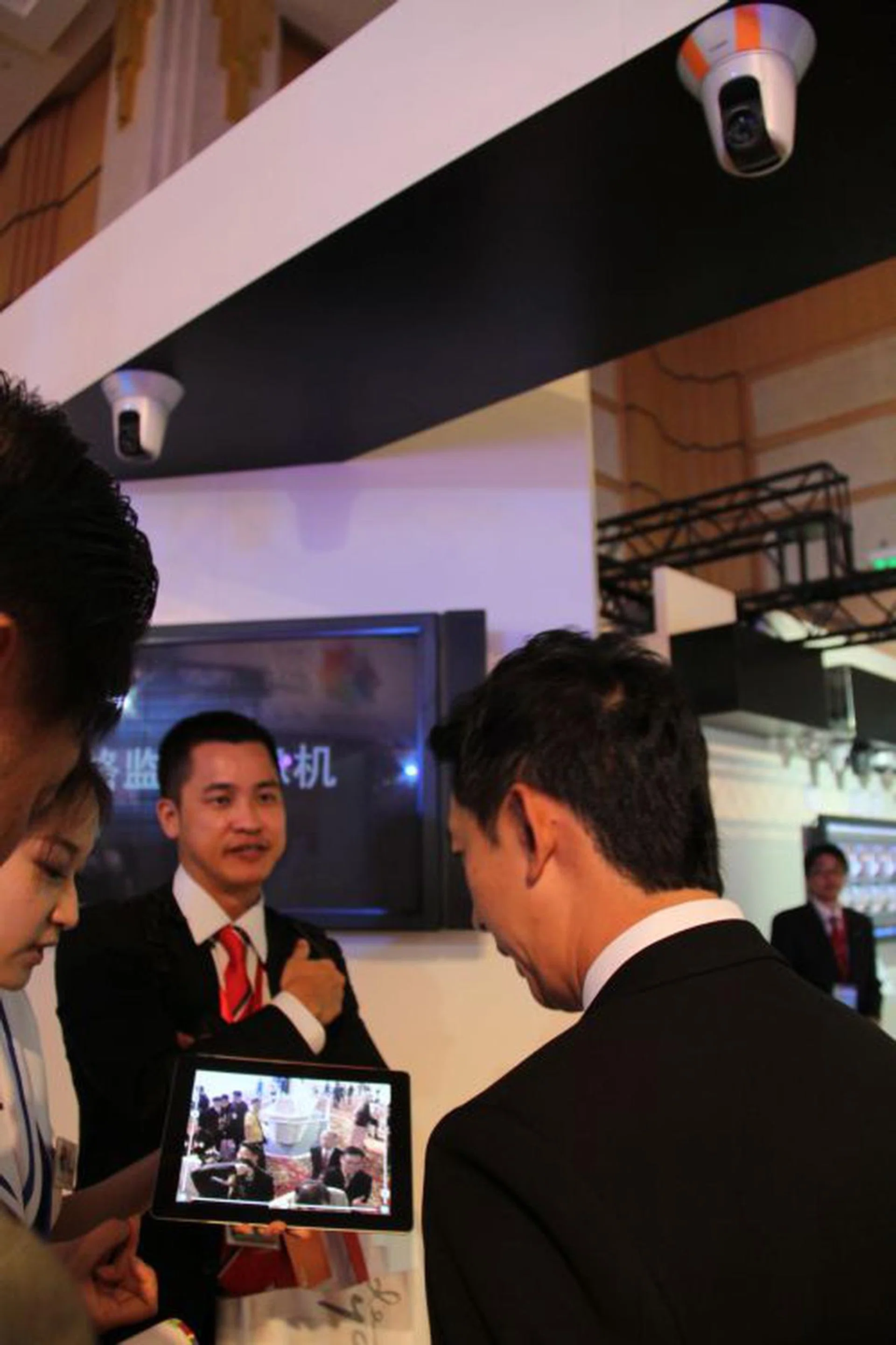 Canon demoed a remote surveillance network camera where users can control and view via a portable device like a tablet.