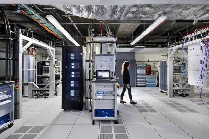 An IBM quantum scientist walks across the IBM Q computation center at the Thomas J Watson Research Center in Yorktown Heights, New York. Image courtesy of IBM